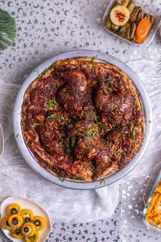 Palestinian Musakhan - Traditional Palestinian Musakhan made with one whole chicken, marinated and baked with onions, sumac, and olive oil, served on freshly baked taboon bread.
(Contains one whole chicken)