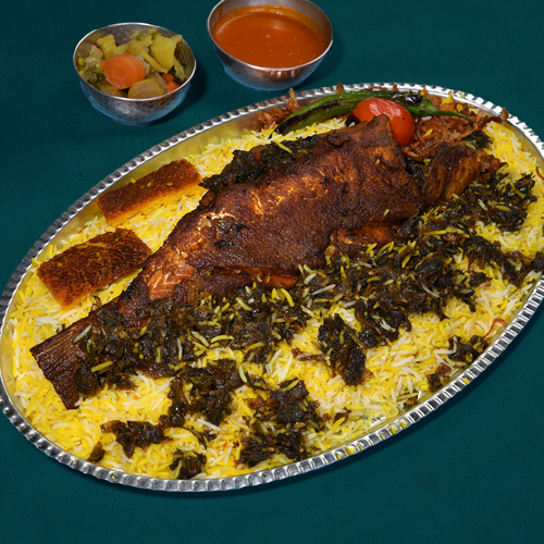 Mutabiq Sea Bass - Fried marinated Sea-Bass fish with saffron rice
  aside a mixture of dill, coriander and tamarind served with Daqous