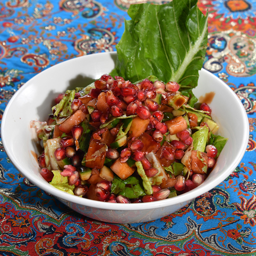 Pomegranate Salad - Pomegranate, tomato, cucumber, lettuce, pomegranate molasses, olive oil and lemon.