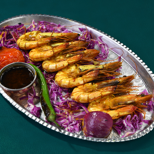 Shrimp Grill - 6 pieces of fresh shrimp grills mixed the iranian dressing served with fish stew with warm bread.