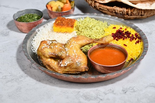 Rice With Chicken - Half fried chicken with mix rice the iranian dressing and served with daqos with warm bread.