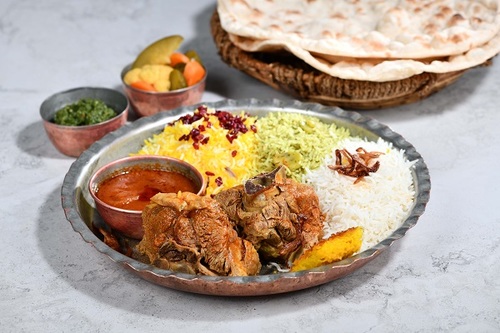 Rice With Meat - Pieces fresh meat cooked iranian way with mix rice the iranian dressing and served with daqos with warm bread.