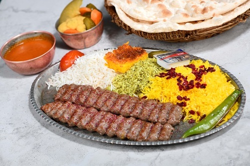 Kabab Rice - 2 skewers of kabab fresh meat with mix rice with the iranian dressing and served with daqos with warm bread.