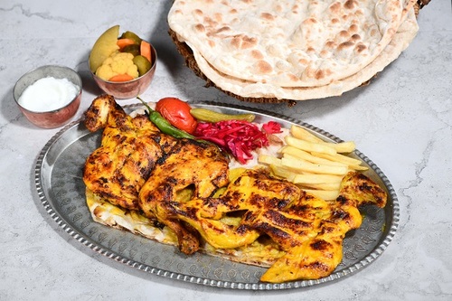 Grill Chicken - Fresh chicken in coal with the iranian dressing in a manner yas and served with french fries and surfs yas with warm bread.