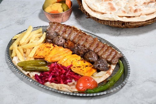 Mix Grill (1 Person) - One skewer of kabab, tikka, shish taouk with the iranian dressing with french fries with warm bread.