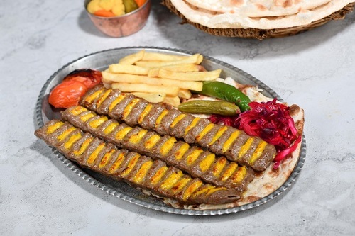 Yas Kabab - 3 skewers of fresh meat mixed with slices chicken dressing with saffron with the iranian dressing with french fries with warm bread.