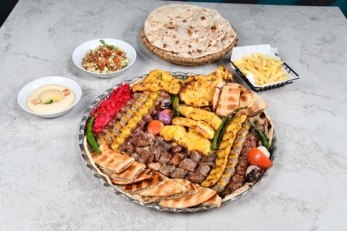 Mix Grill For 6 Per - 3 Iranian kebab,2 kebab yas, 3 shish tawook,2kebab chicken, 3 tikka meat, 3 arayes bread, half chicken on charcoal, hummus, Shirazi salad, 6 Pepsi with service yas and tanour bread.