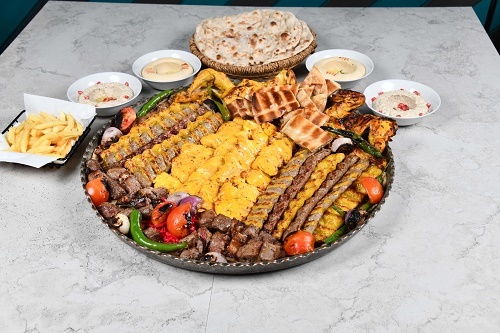 Tray Mix Grill Yas For 10 Per - 4 Iranian kabab, 4 kabab yas,4 chicken kabab , 4 shish tawook, 5 tikka meat, 4 arayes bread, grill chicken, 2 hummus, muttabal shirazi, served with  yas service and Tannour bread.