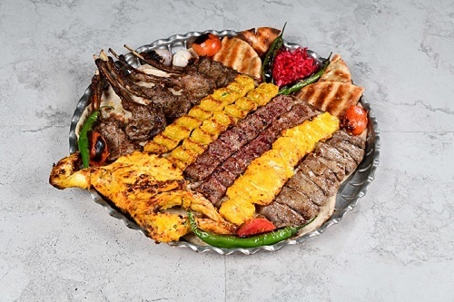 Aldhiafa Tray For 5 People - 5 pieces of lamb chops, lari kebab, 10 pieces of shish tawook, 3 Iranian kebab, 2 chicken kebab, shirazi salad, hummus, with Yas service and tannour bread.