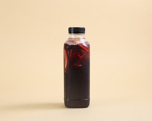 Vimto Booste - A delicious mix of kiwi syrup, Vimto, and lemon.