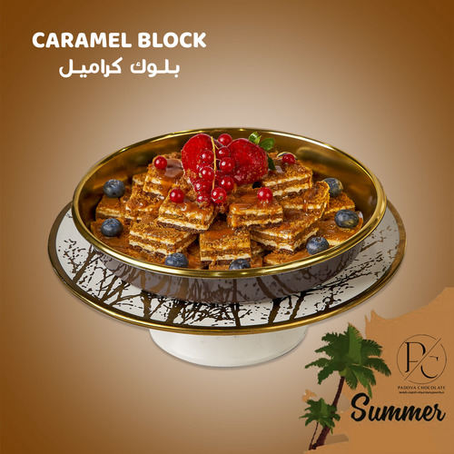 CARAMEL BLOCK - Biscuit pieces stuffed with special Padova cream, decorated with caramel, blueberries, red current and strawberries.