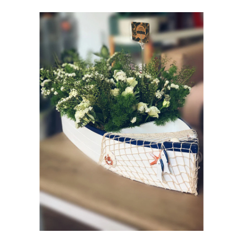 F#6 - A bouquet of natural flowers in a large boat-shaped wooden vase