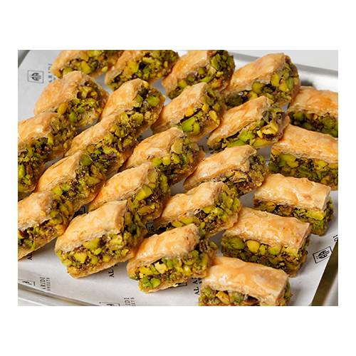 Baklawa Pistachio - Prepared from crisp dough sheets, stuffed with pistachio and sweetened with syrup.