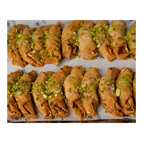 Baklawa Crescent Walnuts - Prepared from crisp dough sheets, stuffed with Wallnuts seasoned with cinnamon shaped like a Crescent and sweetened with syrup.