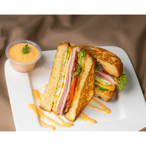 Club Sandwich - Mortadella, eggs, cheese, smoked turkey, tomato, lettuce, and delicious special sauce.