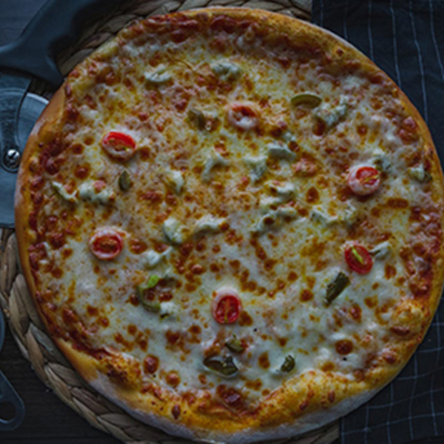 Jalapeno Pizza - A flat bread layered with juicy tomato sauce topped with shredded Mozzarella cheese and pieces of fresh Jalapeño