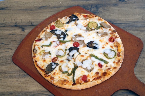 Italian Vegetable Pizza - A Pizza sauce, mozzarella cheese, green pepper, onion, eggplant, zucchini and tomato slices