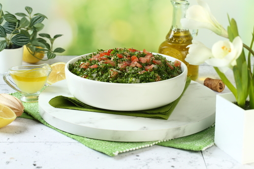 Tabbouleh - Tabbouleh salad with onions, tomatoes and bulgur with dressing sauce