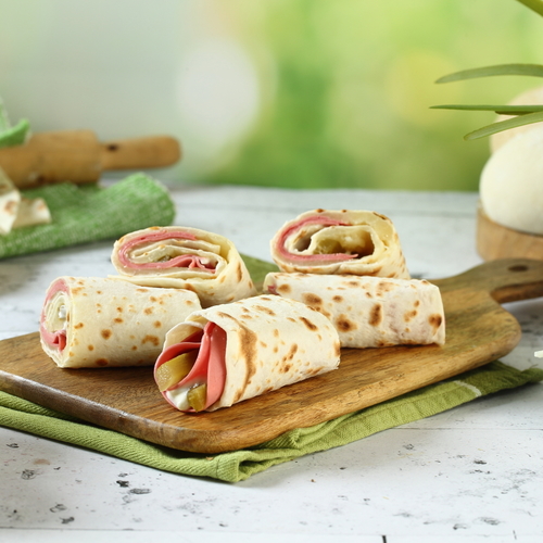 Mortadella With Cheese - Mortadella served with mayonnaise and pickles topped with kashkawan cheese.