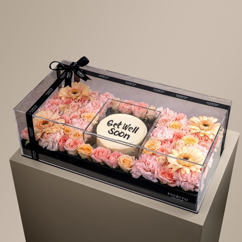 Buttery - Baby roses, gerbera and a cake in an acrylic box. Conveys warmth and well wishes during their healing journey. Note: Cake writing is customizable.