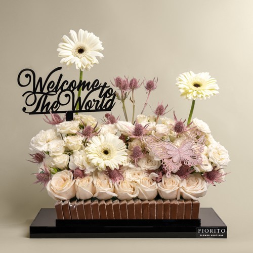 Belle Girl - Acrylic tray with roses, baby roses, gerbera and indulgent chocolate. It's a sweet gesture to greet the newest member of the family and shower them with love and warmth.