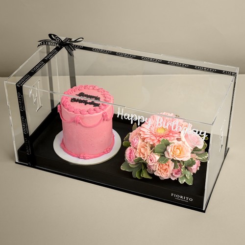 Dreamy - This acrylic box contains rose and gerbera flowers with a cake.