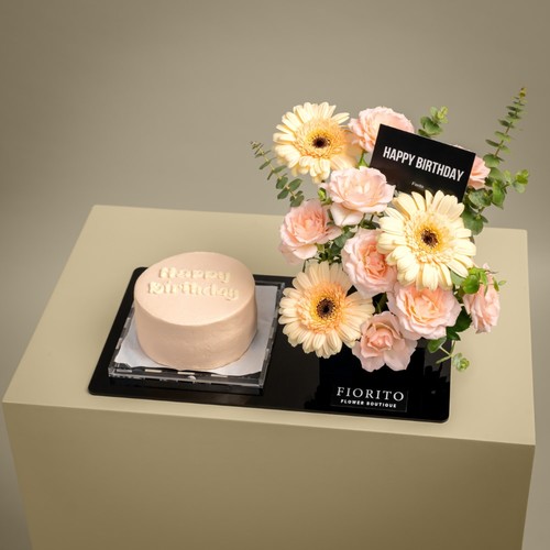 Joyful Dream - An acrylic tray filled with gerbera, baby roses, and eucalyptus with a cake. A great gift to celebrate birthdays and bring joyfulness. Note: Cake writing is customizable.