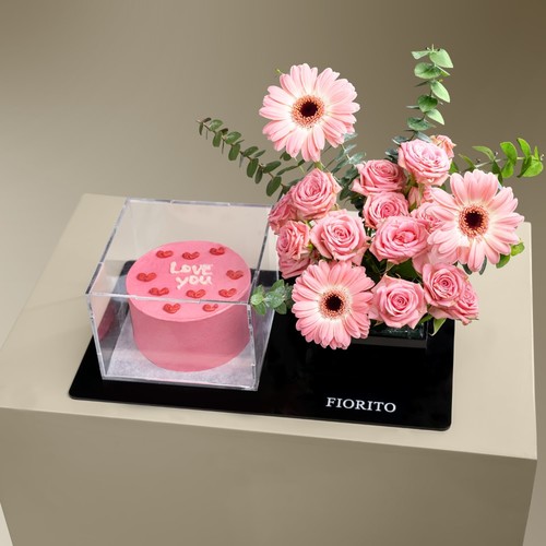 Timeless Affection - An acrylic tray filled with baby roses, gerbera and a delightful cake. Shares your true feelings of love to your closest one's. Note: Cake writing is customizable.