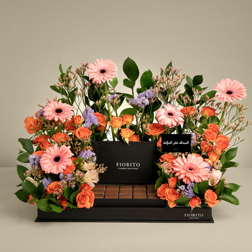 Choco Tray - A tray filled with roses, gerberas, and alstroemerias with delicious French chocolates. Perfect for wishing recovery or to brighten someone's day.