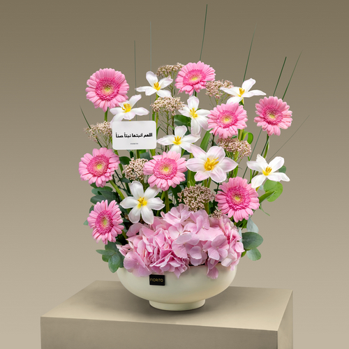 Sweet Arrival - A vase filled with tulips, gerbera, and hydrangea. A perfect gift to welcome them to their new world.