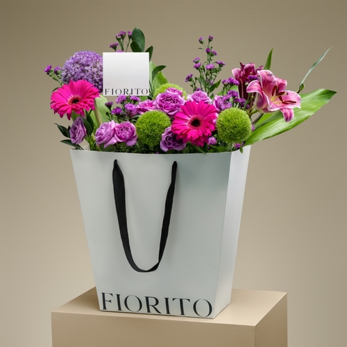 Dazzling - A basket with baby roses, gerbera, aster, and star gazer brings an elegant and modern touch to any occasion.