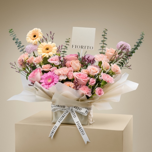 Luminous Blooms - A box contains baby roses, roses, gerbera, and carnations. A cheerful elegant gift to bring joy and happiness to any of your occasions.