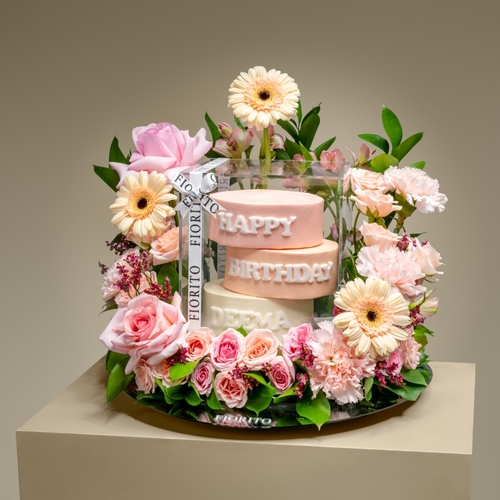 Peach Charm - A reflective glass tray with baby roses, alstroemeria, gerberas, and a cake. A perfect way to send birthday cheer and make their day even more memorable. Note: cake writing is customizable.