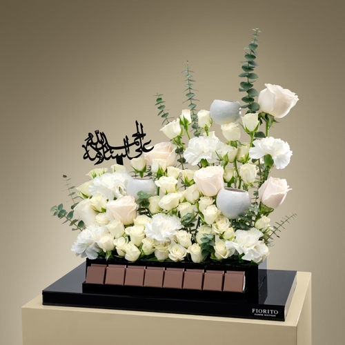 Noble Comfort - An acrylic tray topped with baby roses, roses, carnations, and delicious French chocolate. Designed to bring beauty and tranquility to their healing journey.