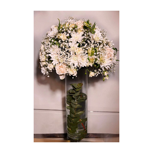 Tawasef Vase - A classic vase containing a group of beautiful flowers: roses, baby roses, alstroemeria, cherries, and gypsophila. As for the colors and length of the vase, it is your choice.