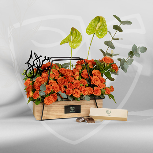 Orange - basket with flowers and chocolate with plaxy name Size : 35*35 cm