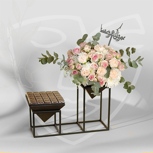 The Pyramid - stand with flowers and chocolate with plaxy name Size : 45*40 cm