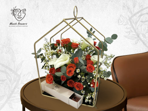 golasio - Gold iron stand with chocolate and beautiful flower arrangement of a mix of Dutch and Ecuadorian flowers to suit all tastes Size 45/35cm