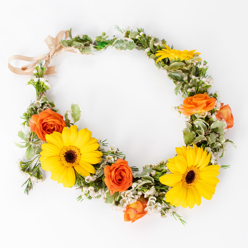 Taj - A crown of gerbera and baby roses with a customized name.
