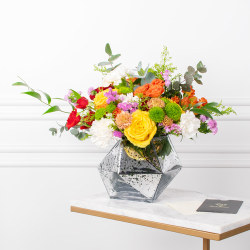 Star And More - Roses, baby roses, chrysanthemums, and carnations arranged beautifully in a vase with a card.