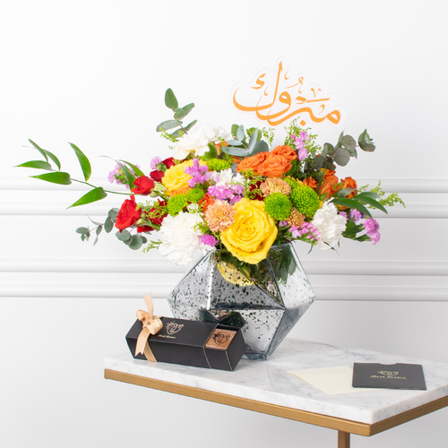 Star - Roses, baby roses, chrysanthemums, and carnations arranged beautifully in a vase with a card, an acrylic topper, and chocolates.