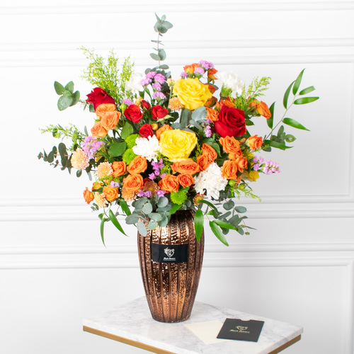 Classic - Roses, baby roses, chrysanthemums, and carnations arranged beautifully in a vase with a card.