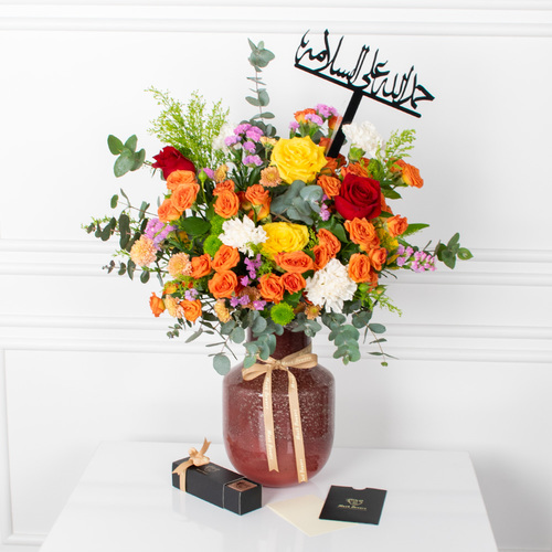 Beauty Color - A vase that contains roses and carnation with a chocolate box and acrylic name and card.
