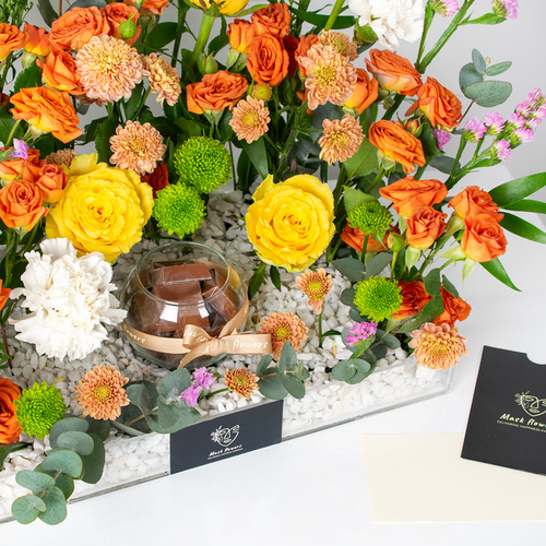 Butterfly - A tray filled with chrysanthemums, roses, carnations and eucalyptus along with chocolates.