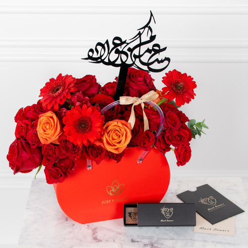 King Love - A box filled with roses and gerberas along with chocolates.