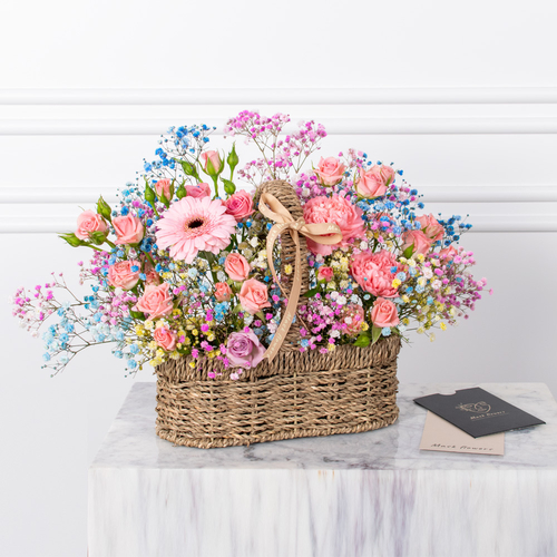 Natural Flowers - Baby roses, gypsophila, gerberas, and carnations arranged beautifully in a basket with a card.