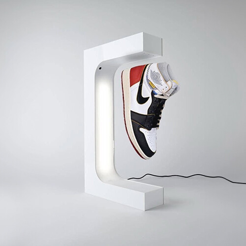 Levitating And Spinning Shoe Display black - White color levitating and spinning shoe display. Could be used to display bags or any other compatable objects. 44cm*23.5cm *7cm