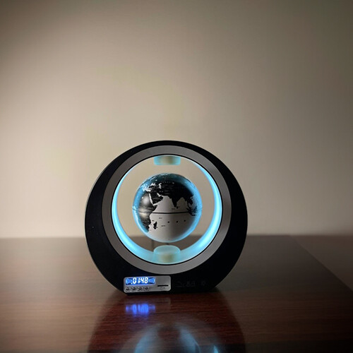 Bluetooth Speaker - O shape LED ring centered by black and white speaker Globe with Chinese writings. And Chinese sound when turned on. Easy to connect by Bluetooth. Could be left on always. Globe : 10.5 cm O- Shape: D: 22cm Thickness : 5cm