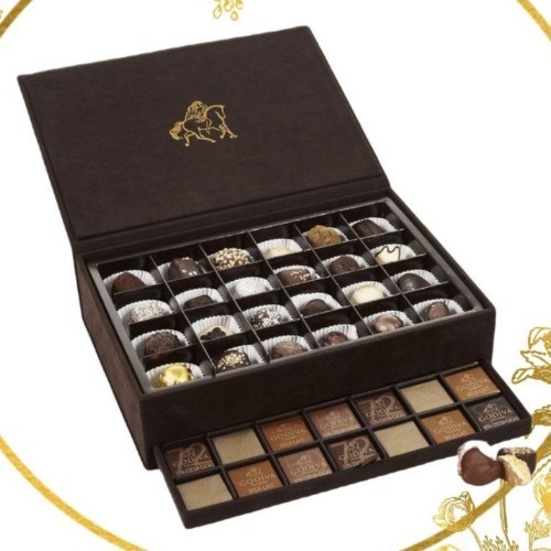 Brown Velvet Box - Mini Velvet brown box - contains 18pcs chocolates, 6 assorted chocolates and 12 Godiva Carre.

 Medium Velvet brown box - This box contains 30 different types of Godiva chocolates and 30 Carres 

Large Velvet brown box - This box contains 48 different types of Godiva chocolates and 70 Carres.

Extra Large velvel brown box - This box contains 56 Assorted Godiva chocolates and 144 Godiva Carres.