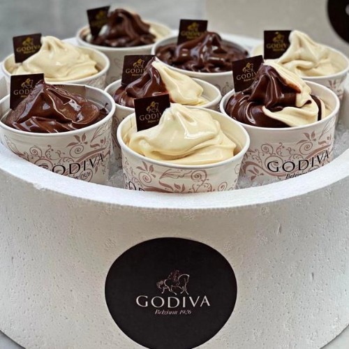 Eight Large Assorted Ice Creams - Ice Cream comes in Three Variations: Signature Godiva Dark Chocolate Soft Serve ( Rich, dark and decadent Godiva Soft Serve), Classic Godiva Vanilla Soft Serve Cup (Luscious, classic vanilla Godiva Soft Serve) and Swirl Soft Serve Cup ( A swirl of our Signature Godiva Dark Soft Serve and CLassic Vanilla Soft Serve).